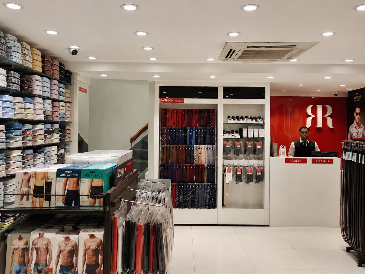 Inside the Raymond Paldi store - shirt wall, tie display and billing counter